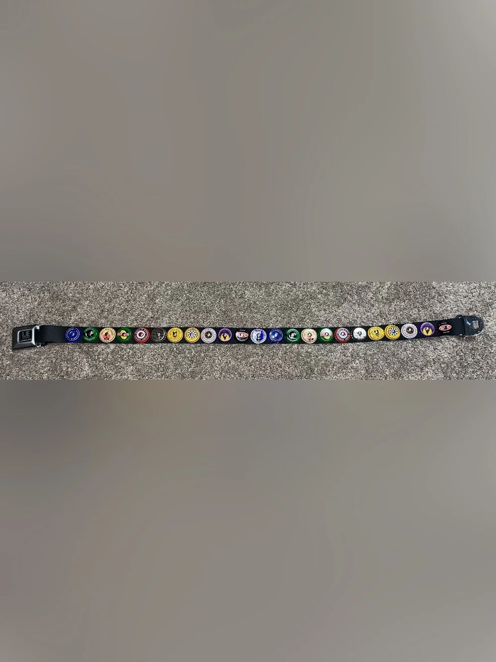 Little Earth seatbelt belt bottle caps